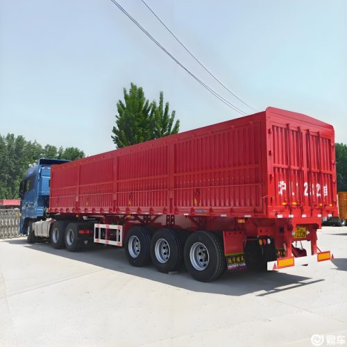 three axle side dump trailer for quarry roadwork and controlled side discharge
